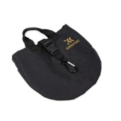 The Exxentric Flywheel Bag is a black fabric bag with EXXENTRIC in gold, a handle, buckle clasp, carabiner clip on the front, and a rounded bottom.