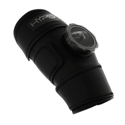 The Hyperice Ice ICT Compression Technology Knee is a black compression sleeve with an adjustable strap and circular pump for applying pressure, designed to enhance recovery and reduce soreness in limbs.