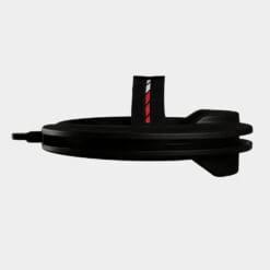 Side view of the Iron Neck 3.0: a black, round object with a handle featuring a black strap adorned with red and white stripes, set against a plain gray background.